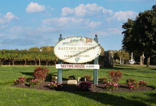 a sign for a sitting hollow ancestral testing house at Sea Cliff Charm: 5 Mins to Beach, Firepit in Wading River