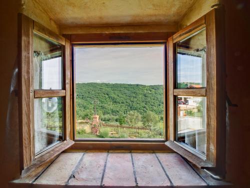 an open window with a view of a mountain at Dobrinja Residence Villas Lopar in Marezige