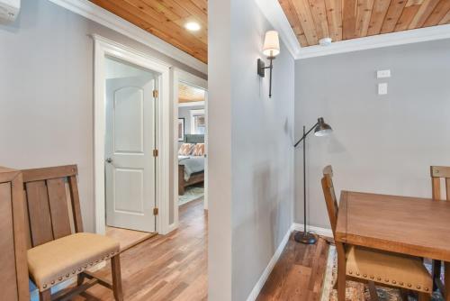 a dining room and kitchen with a table and chairs at Alpine Chalet Nature Lovers Rejoice Chic 4 BDR in Alpine Meadows