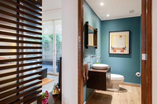 a bathroom with a toilet and a sink at Mi casa #2 at Polanco's most exclusive area in Mexico City