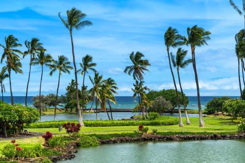 a view of the ocean and palm trees at Mauna Lani Terrace D203 in Waikoloa