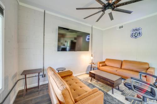 a living room with a couch and a table at 7 Mi to Dtwn Tulsa Dog-Friendly Home with Yard in Tulsa