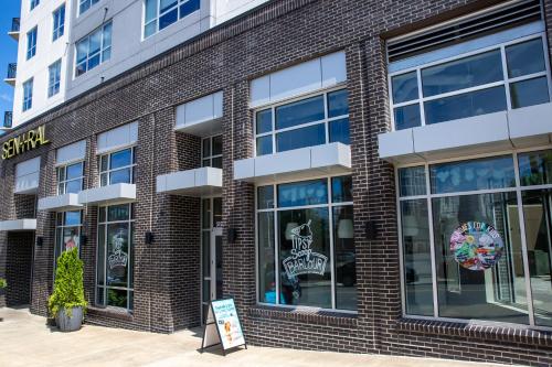 a store front of a brick building at Sentral SoBro in Nashville