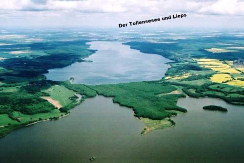 an aerial view of a river with trees and water at Ferienwohnungen "Christelhof" in Wustrow