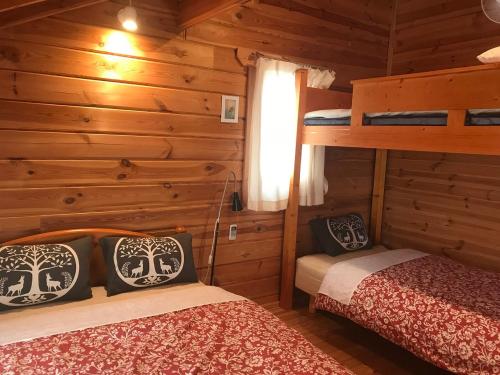Ένα ή περισσότερα κρεβάτια σε δωμάτιο στο The Summerhouseizu Two