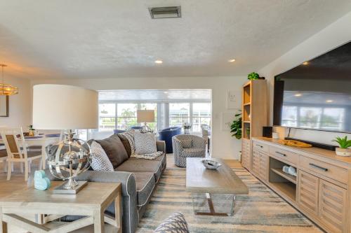 a living room with a couch and a table at Canal-Front Haven Pool, Dock and Lanai in Palmetto in Palmetto