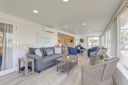 a living room with a couch and chairs at Canal-Front Haven Pool, Dock and Lanai in Palmetto in Palmetto