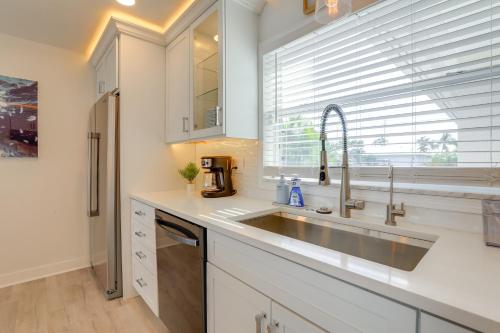 a kitchen with a sink and a window at Canal-Front Haven Pool, Dock and Lanai in Palmetto in Palmetto
