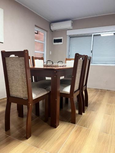 a dining room table and chairs in a room at Carmelo House in Carmelo