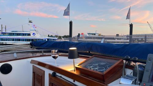a boat with a glass of wine on the deck at Seewolf in Cuxhaven