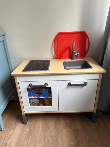 a small kitchen with a sink and a stove at The Old farm house in Iceland in Selfoss