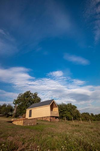 a building in the middle of a field at LisHills in Umanʼ