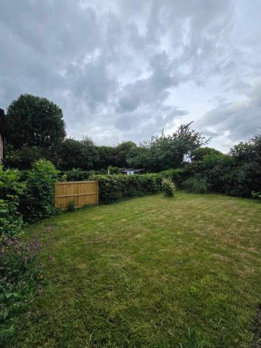 a yard with a fence and a grass field at The Shoulder at Hardstoft in Hardstoft