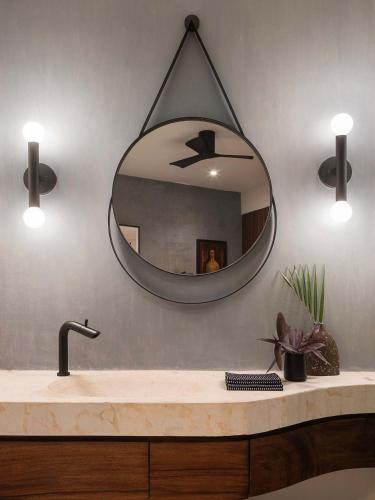 a bathroom sink with a large mirror on the wall at Punta Majahua by PRC Hospitality in La Majahua