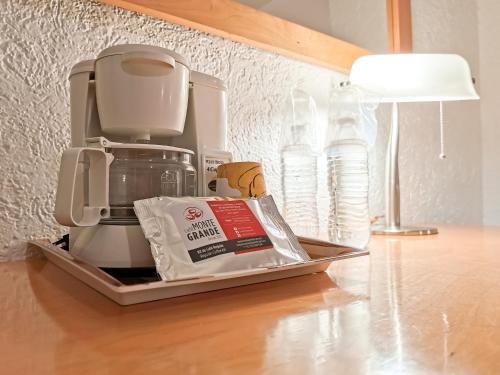 a coffee maker sitting on top of a counter with food at HOTEL DON MIGUEl in Tapachula