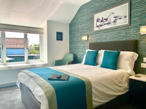 a bedroom with a bed with a tray on it at Gordons in Cheddar