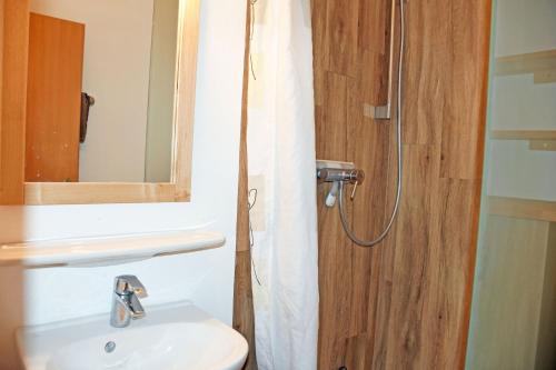 a bathroom with a toilet and a sink and a shower at Appartementhaus auf Moenchgut in Thiessow