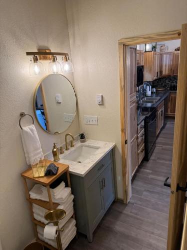a bathroom with a sink and a mirror at The Bonnie View in Keystone