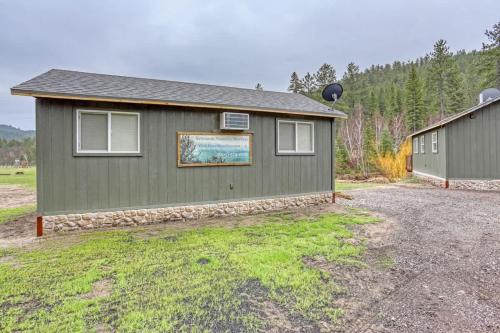 a house with a sign on the side of it at Rustic getaway in the woods in Keystone