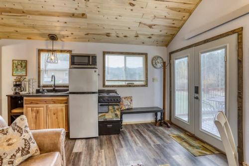 a kitchen with a refrigerator and a stove at Cozy Creekside Retreat in Keystone