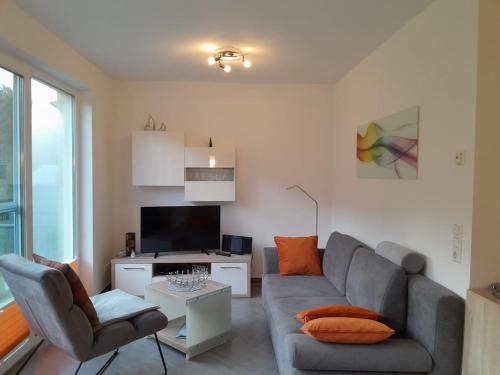 TV a/nebo společenská místnost v ubytování Ferienwohnung Igelring 47 OG Scheidemann GM 69821