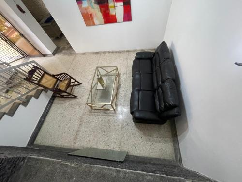 an overhead view of a chair and a mirror at Baranoa House in Barranquilla