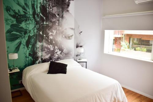 Una cama o camas en una habitación de Alquileres Temporarios by CLH Rentals
