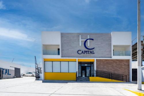 a building with a c capital sign on it at Capital Hotel Saltillo in Saltillo