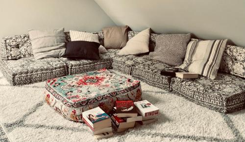 a living room with a couch and boxes on the floor at Chalet Sch l afbock in Priesteblich