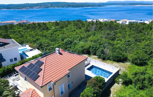 an aerial view of a house with solar panels on the roof at Amazing Home In Crikvenica With Wifi in Crikvenica