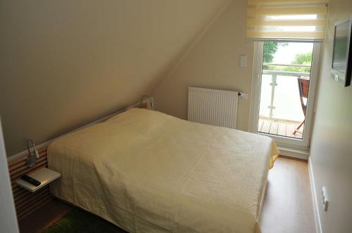 Postel nebo postele na pokoji v ubytování Ferien_HAUS AM SEE