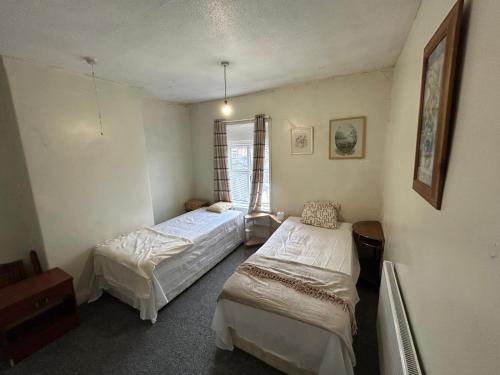 Postel nebo postele na pokoji v ubytování Stoke Staycation The Quiet Corner