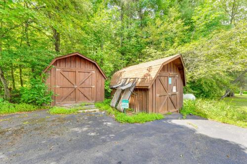 a couple of wooden buildings sitting in a parking lot at 1 Mi to Hunter Mtn Cozy Unit on 6-Acre Property! in Hunter