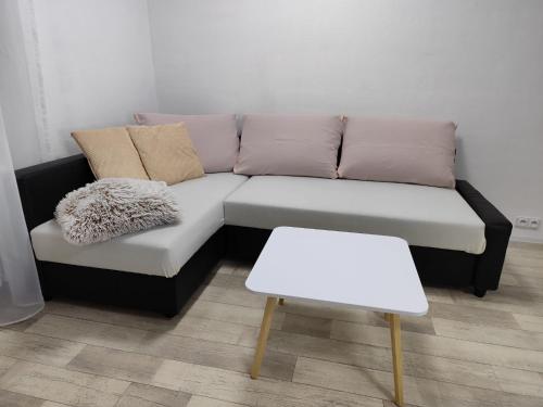 a black and white couch in a living room at Apartmány pod věží in Jindrichuv Hradec