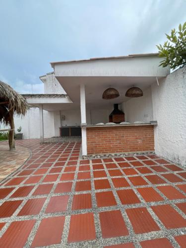 a brick floor in front of a building at Baranoa House in Barranquilla