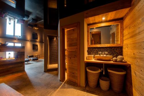 a bathroom with a sink and a mirror at 22 Summits Apartments in Zermatt