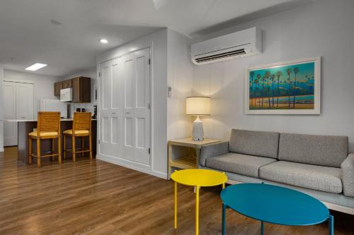 a living room with a couch and a table and chairs at WorldMark Kihei in Kihei