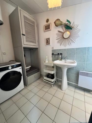 a small kitchen with a sink and a microwave at Aix-en-Provence, Bastidon provençal plein cœur de la forêt avec vue unique in Le Tholonet