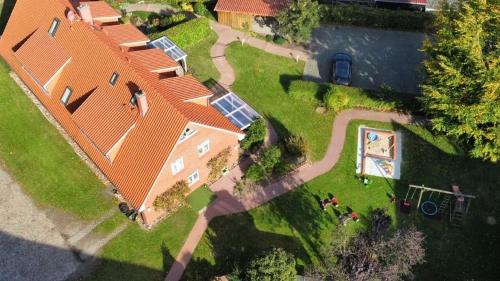 an overhead view of a large house with a yard at Haus-Auetal in Bliedersdorf