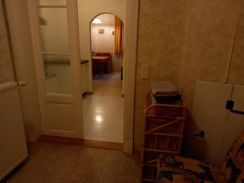 a hallway with a door and a room with a table at Ferienwohnungen Manuela in Schottwien