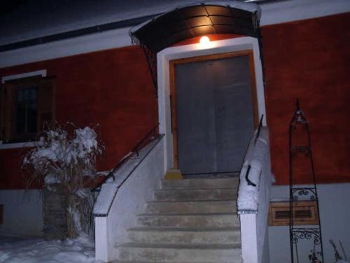 a building with stairs leading to a door at Kellerstöckl in Grosspesendorf
