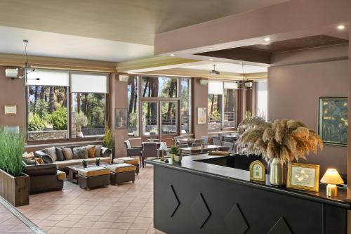 a lobby of a hotel with couches and chairs at Lilea's Castle in Lílaia