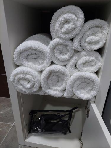a pile of rolled up towels in a drawer at Apartman Ploče in Bajina Bašta