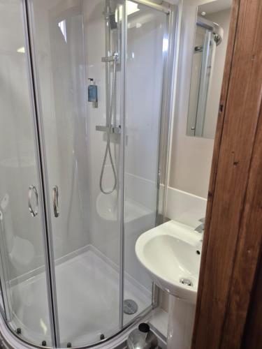 a bathroom with a shower and a sink at Bank House in Inverness