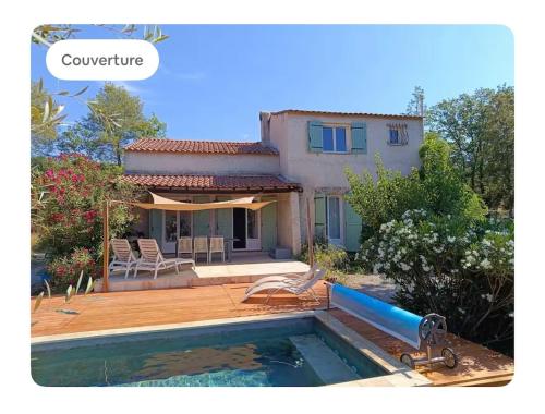 a villa with a swimming pool and a house at Nuit romantique en Provence in Draguignan
