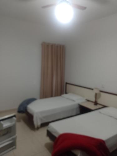 Ένα ή περισσότερα κρεβάτια σε δωμάτιο στο Hotel Vitoria Palace varginha