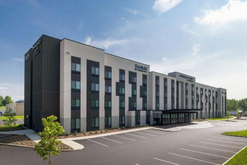 an office building with a parking lot at TownePlace Suites by Marriott Lancaster in Lancaster