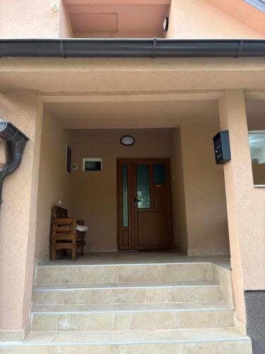 a entrance to a house with a door and stairs at The Budim House in Berane