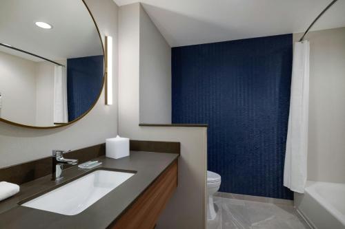 a bathroom with a sink and a mirror at Fairfield by Marriott Inn & Suites Lancaster in Lancaster