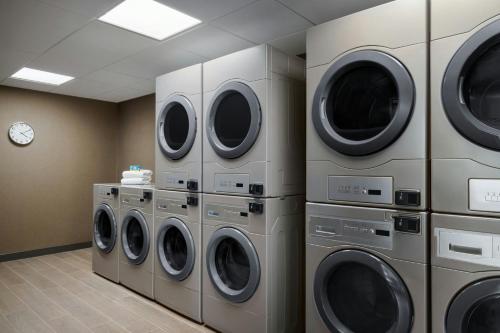 a row of washing machines in a laundry room at Fairfield by Marriott Inn & Suites Lancaster in Lancaster